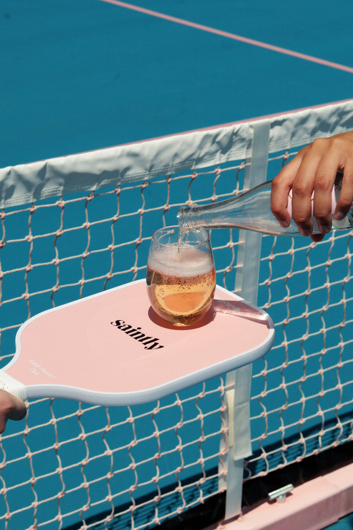 A branded paddle and drink at a brand activation