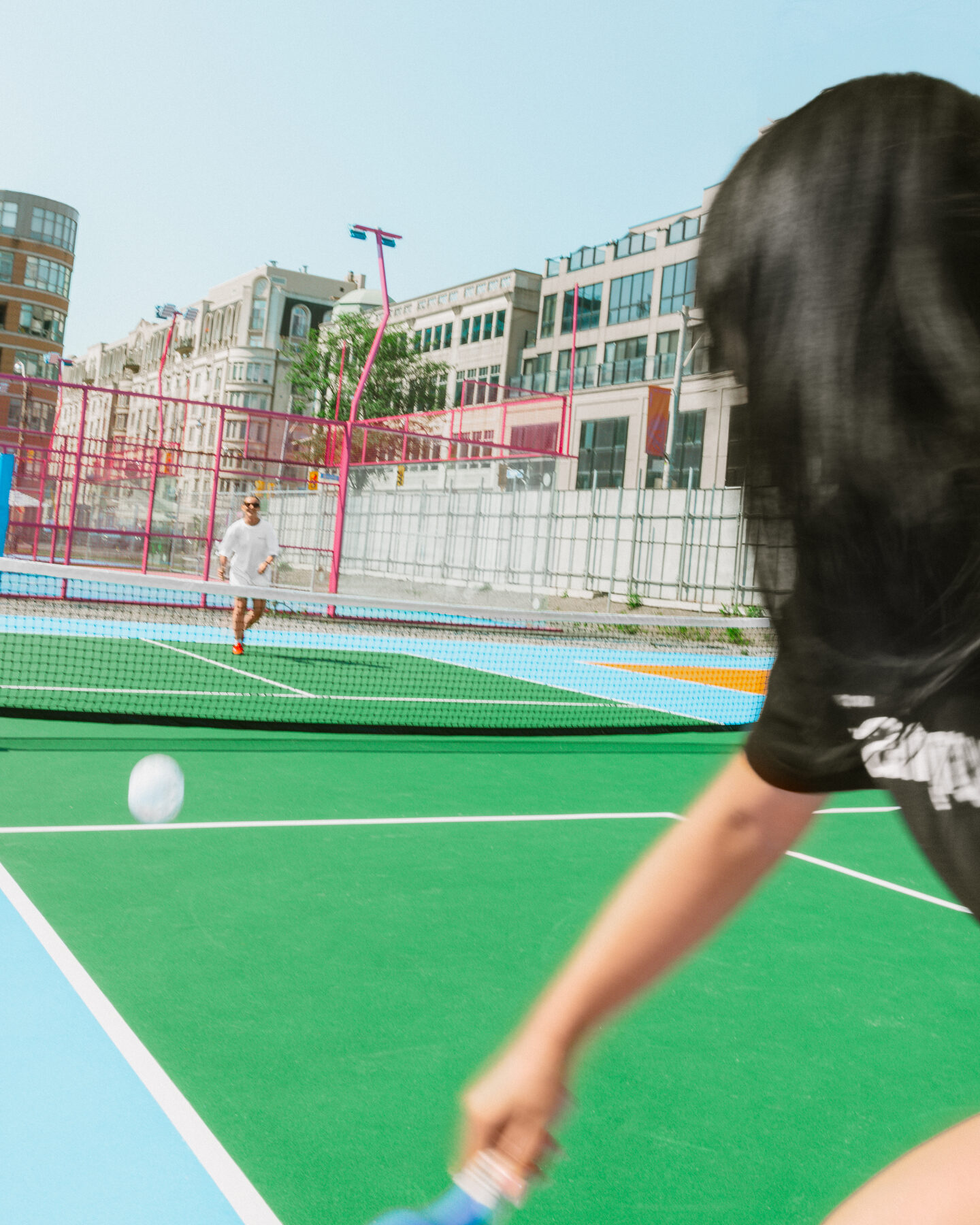A drop-in game on a green Fairgrounds court